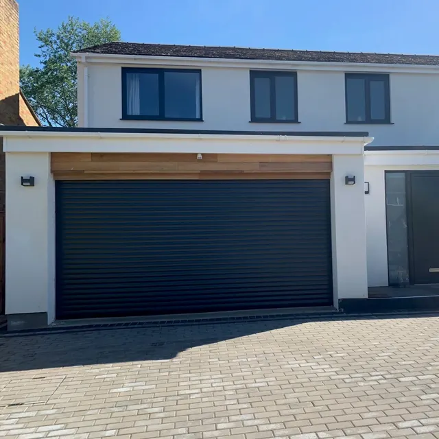 Black sectional garage door installation by Doors 4 Garages Ltd West London
